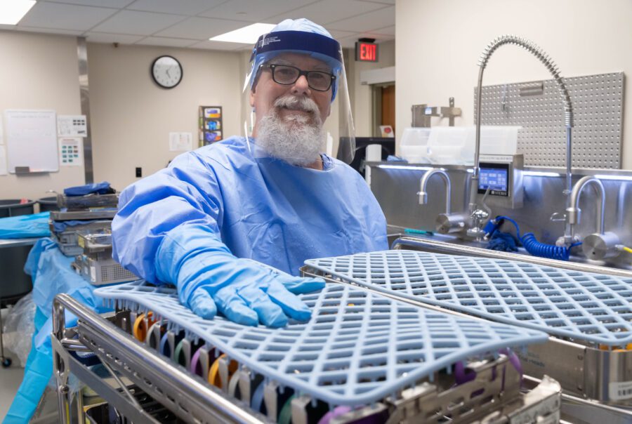 Healthcare worker in protective gear in hospital.