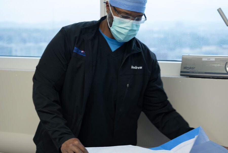 Medical professional preparing surgical materials.
